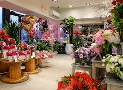 The front door of our Whitestone showroom is stocked with pink and red Valentine's Day arrangements